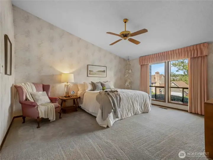 The primary suite has room for a king sized bed set and seating area.