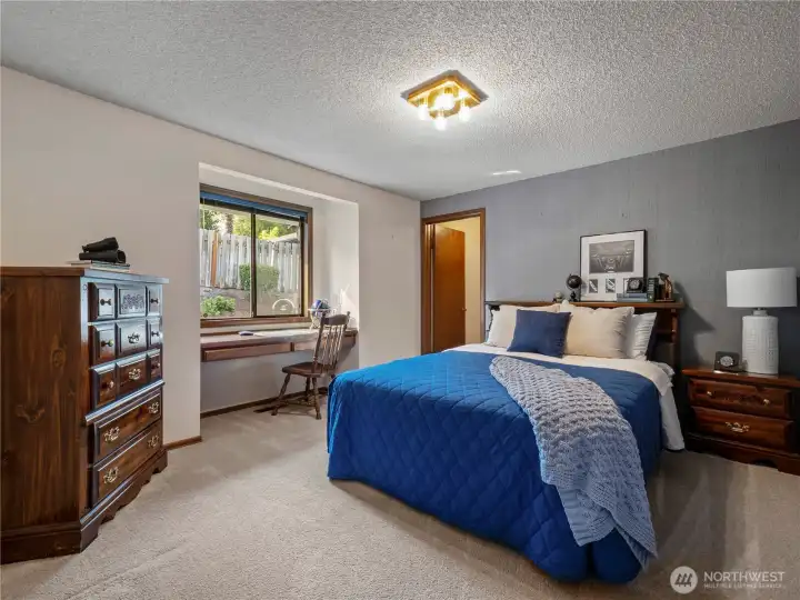 The first of the two additional bedrooms has a large walk-in closet and built in desk.