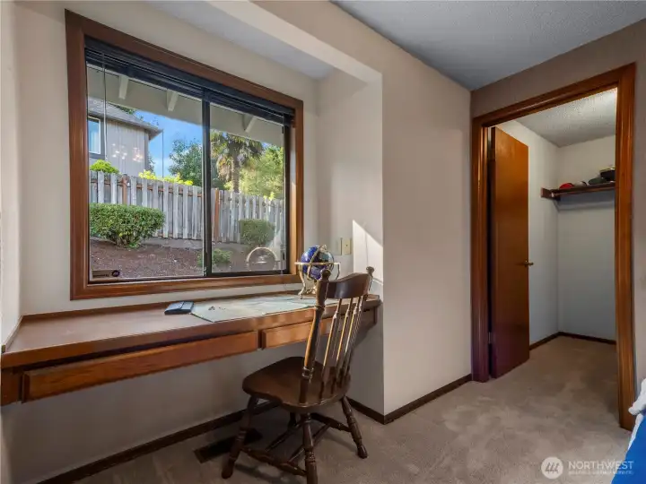 From the desk area you have a view of the beautifully kept backyard.