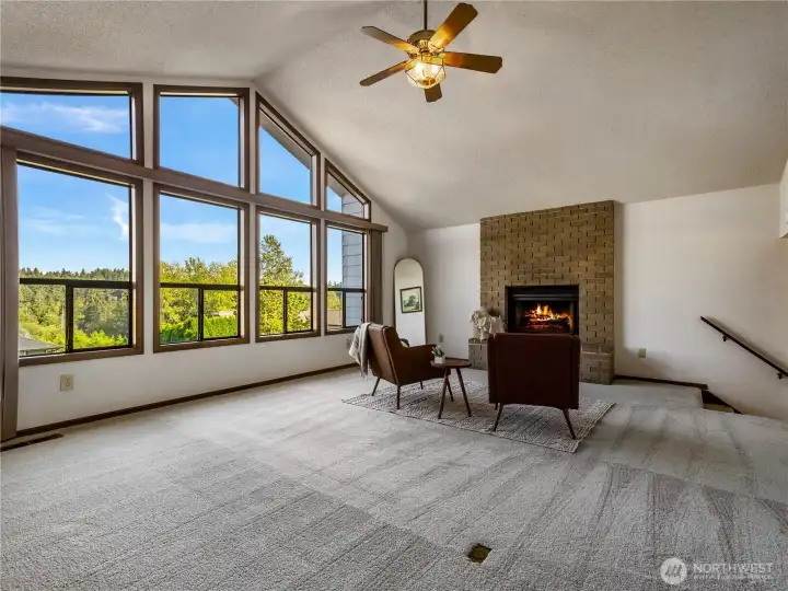 The large windows in the family room mirror the ones in the formal living room.