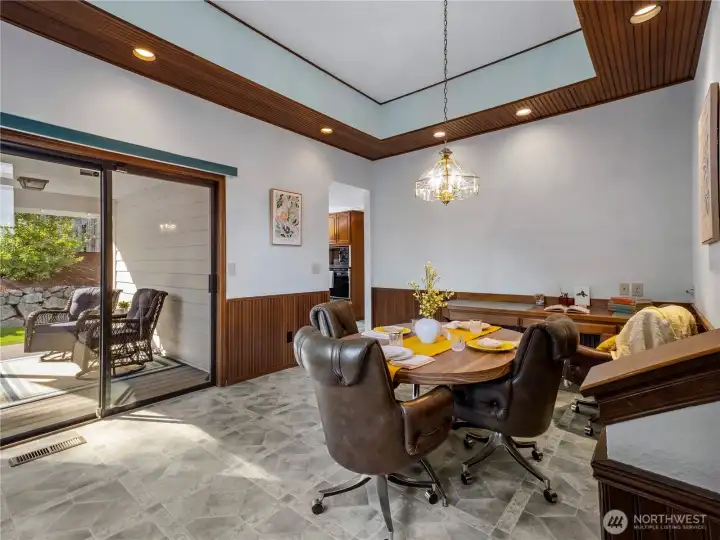 The casual dining room can be found between the kitchen and the family room.