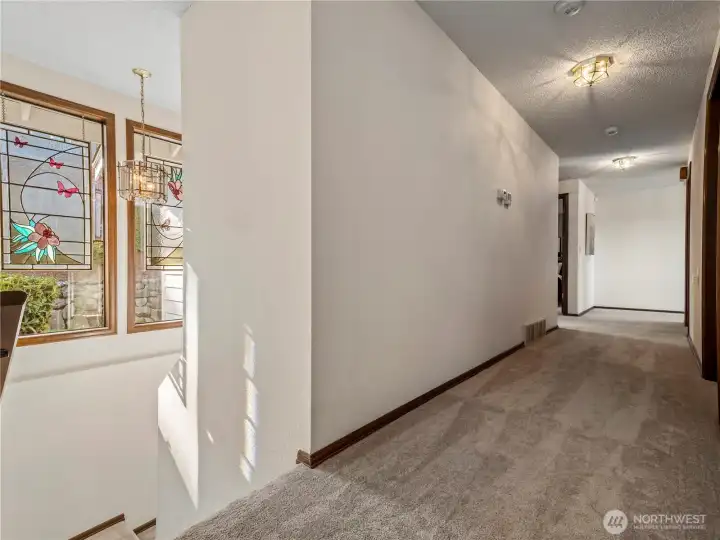 The stair well down to the lower level is also filled with natural light with 2 more large windows.