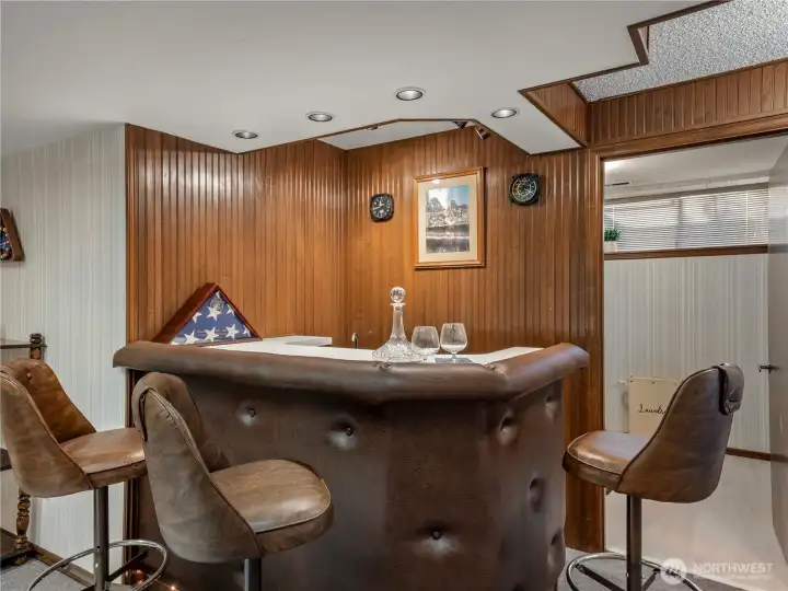 The built in wet bar in the game room has a sink and small refridgerator.