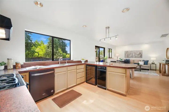 Open Kitchen, trash compactor and wine fridge.