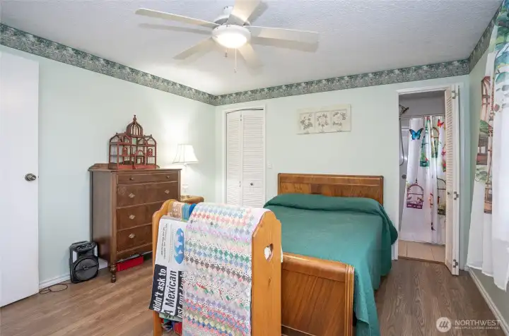 This it primary bedroom with a 3/4 bathroom.