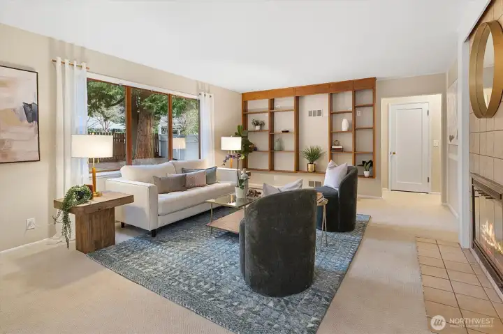 The formal living room features a large picture window looking over the north yard!