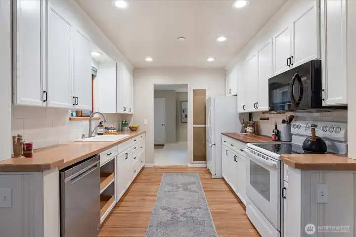 Next to the fridge, under the countertop, is plumbing for a 2nd sink - great for having a helper do food prep!