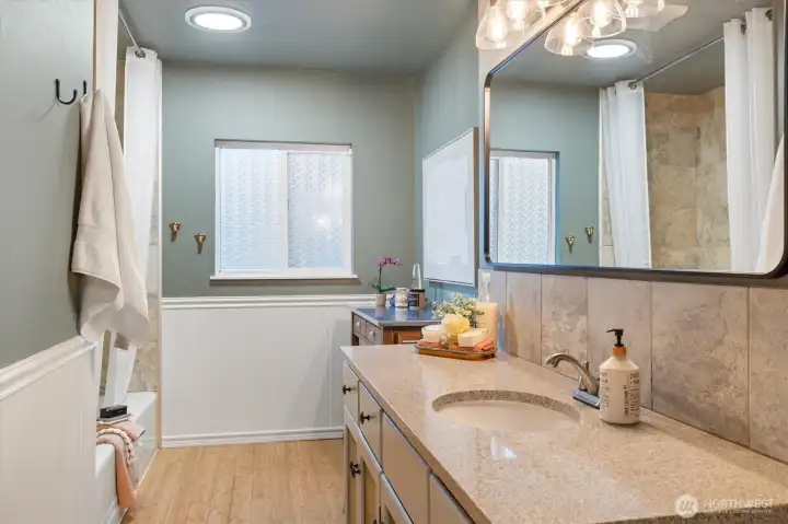 The primary bath has also been extended, with a spacious countertop and soaking tub.