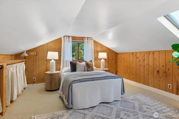 The upstairs bedroom, part of a two-room suite which is a hallmark of Lovell homes.