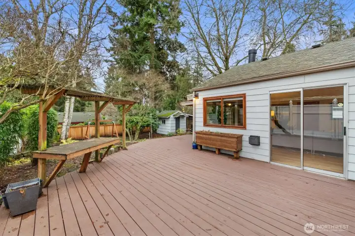 Large deck and covered bench off the flex room and primary bedroom!