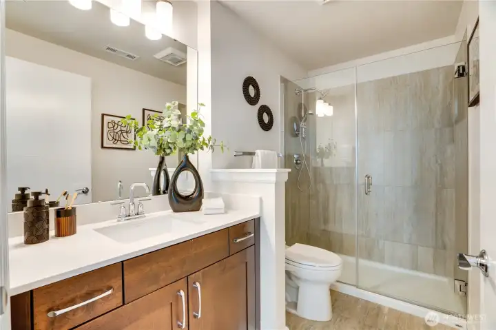 Primary bath offers a serene, spa-like feel—creating a peaceful extension of the suite.