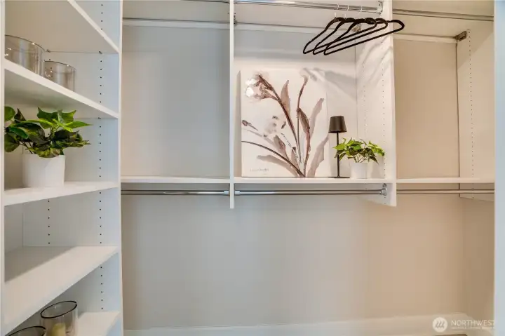 Primary bedroom walk in closet