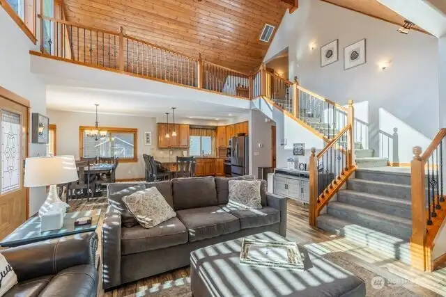 living room looking into kitchen and stair to bedroom 3 & 4