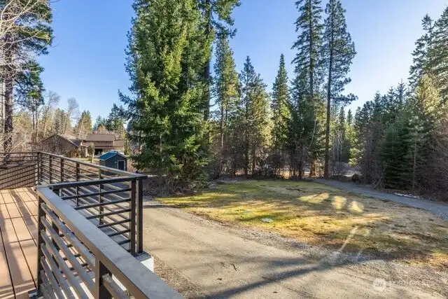 front deck includes outdoor furniture and table which is still in storage shed