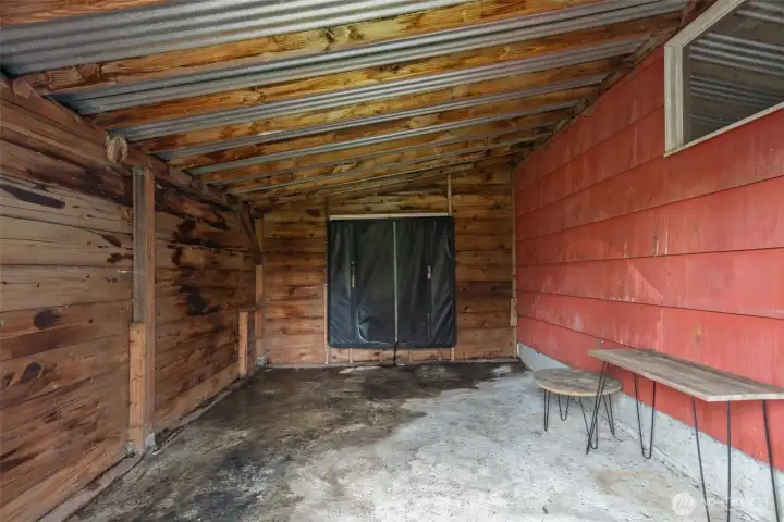 Connected shed/workshop area with power.