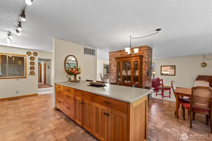 Kitchen to dining and living room.  Island bar is so convenient.