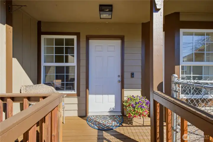 Enjoy this covered porch for relaxing here anytime of the year. Your delivered packages also stay dry.