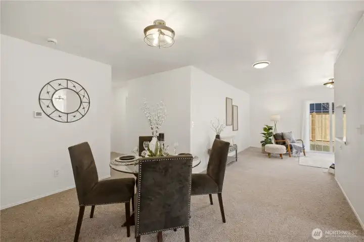 A generous area in between the living room and family room serves as the dining area. It's large enough for a big table for special gatherings!