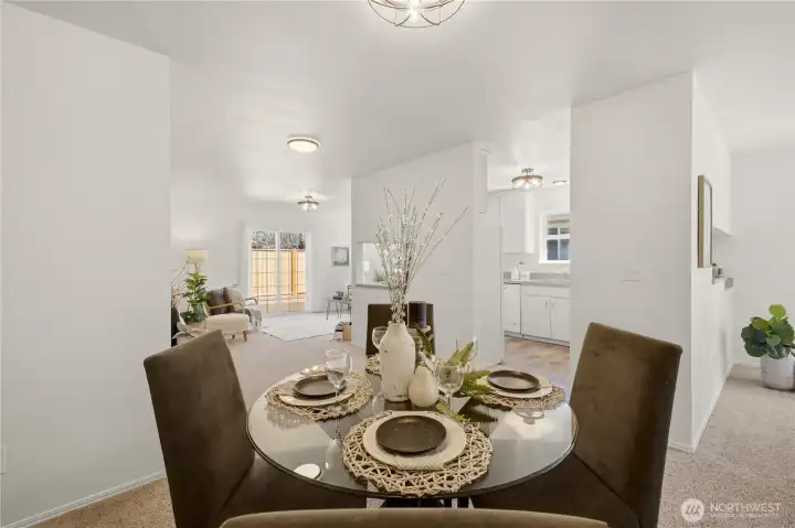 The dining area, looking into the kitchen and family room.
