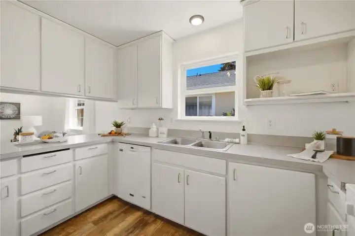 The home chef will find this kitchen to have a very functional and efficient design! A window over the sink invites sunlight in.