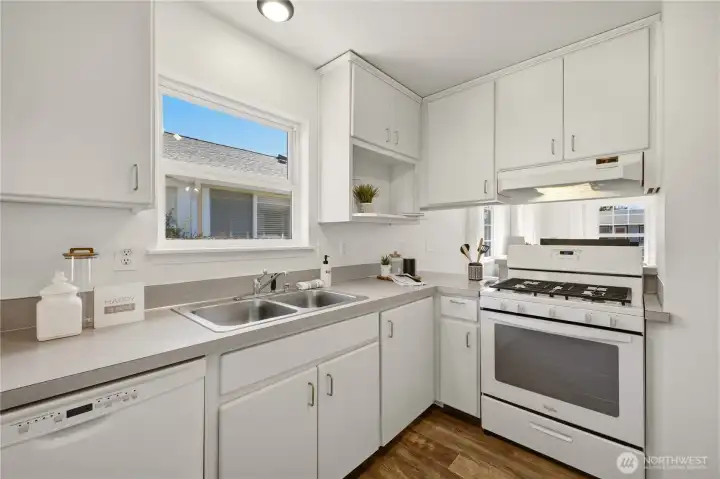 The pass-through opening to the living room allows the home chef to interact with guests while whipping up favorite meals.