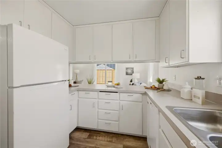 A pass-through opening on the family room side of the kitchen allows the home chef to interact with guests there, too. Smart design!