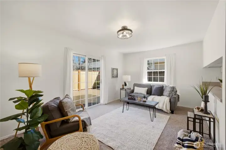 In the back of the home, the family room steps out to the spacious back deck, extending the living space to the outdoors.