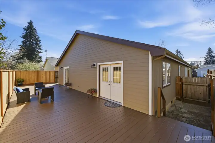 Notice the second set of doors leading out to the deck. That's the primary suite, which has its own access to the deck.