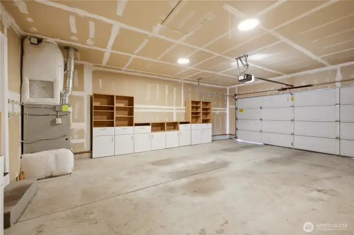Storage shelves and cupboards are ready for your tools and garden supplies in this 517 sq ft, two car attached garage.