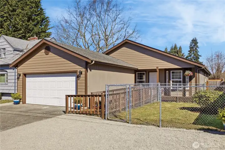 The front yard is also fully fenced, offering an ideal spot for furry 4-legged friends to play and stay secure.