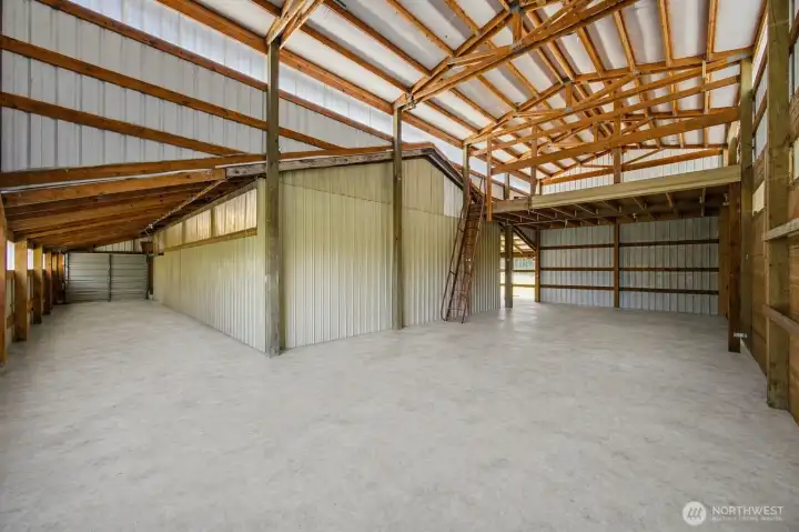 Side garage connects to horse barn. Hay loft above.