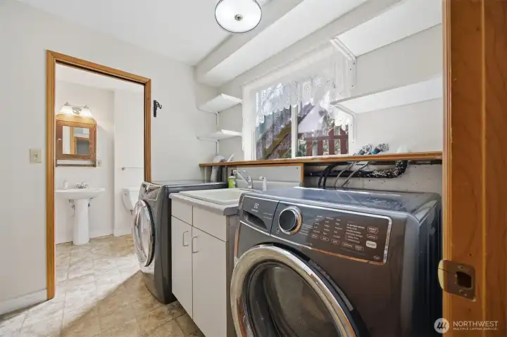 Laundry room leading in to the guest bathroom.