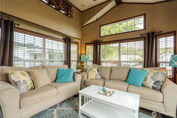 Spacious living room is light, bright & inviting.