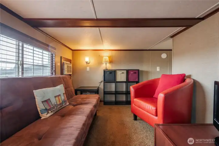 The den is a great place to hang out and relax. This flexible space could also be used for an office, craft room, or even a third bedroom.