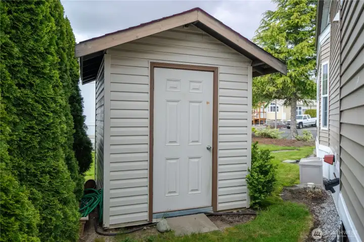 The shed is the perfect place to store the electric lawn mower (included), garden tools and all of your beach gear.