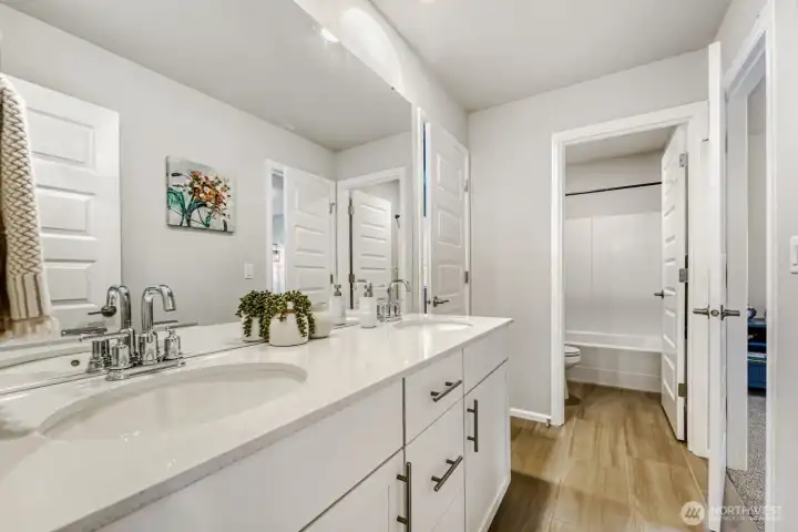 Upper level Jack and Jill bathroom connected to bedroom 2 and 3.