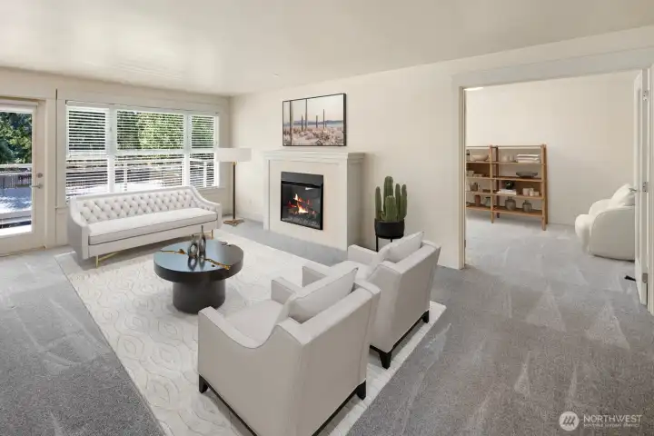 Light-filled living room with French doors leading into the large den.