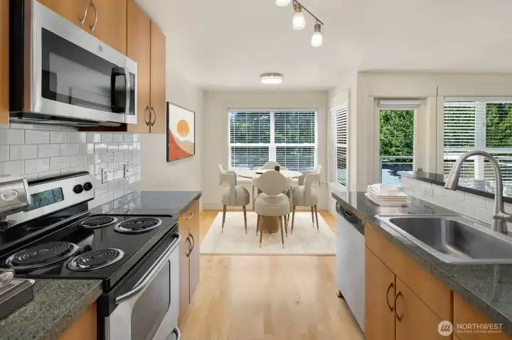 Bright kitchen and dining area filled with abundant natural light