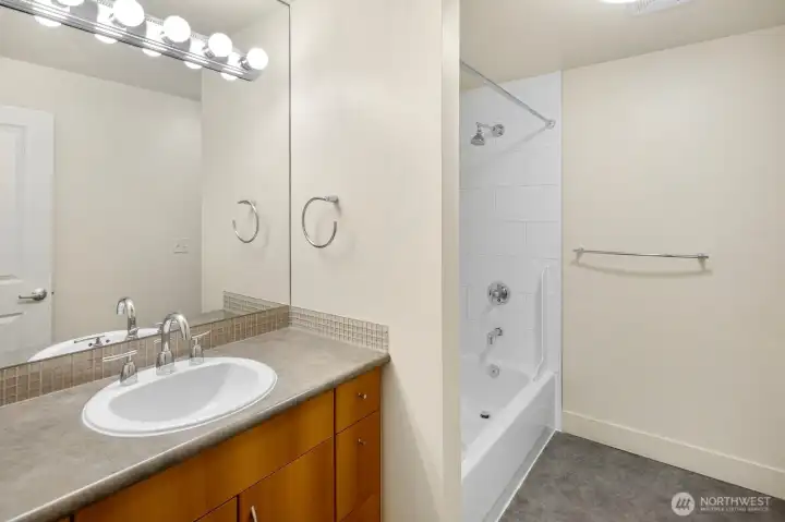 Large full bath with generous vanity storage