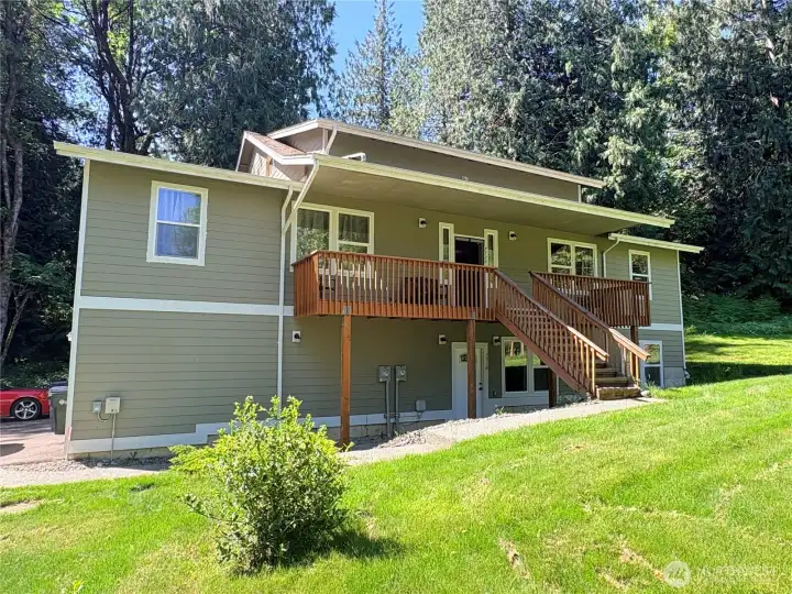 Triplex with main level, daylight basement ADU, and upper-level apartment.