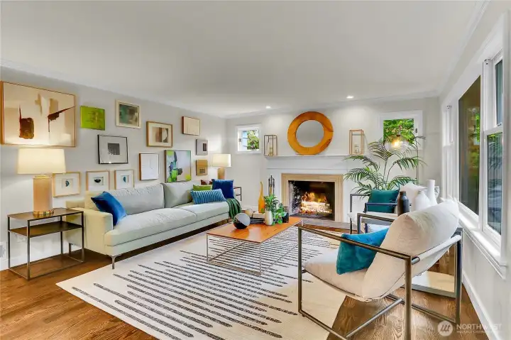 Gracious living room with ample room for art. Cozy Art Deco fireplace to keep you warm in the chilly seasons.