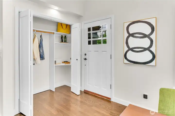Perfectly placed coat closet at entry, with a sweet snail-mail landing pad just to the right inside the closet.