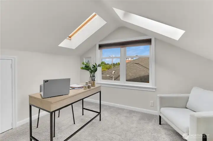 Den/study off the Primary Suite, upstairs. Note the little door to the left - storage in the attic crawl space!