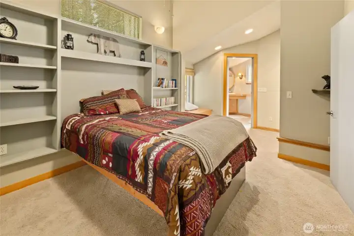 This angle showcases the comfortable bedroom layout and convenient access to the primary bath.