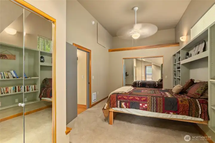 TWO large mirrored closets add both functionality and a sense of openness to the primary bedroom.