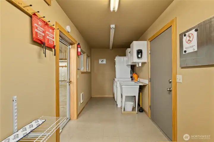 Practical and organized, this laundry space includes a utility sink and ample storage. Washer/Dryer stay. Washer is newer!