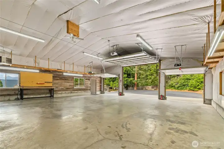 Generous three-car garage offering ample room for vehicles, storage, and a scenic outlook.