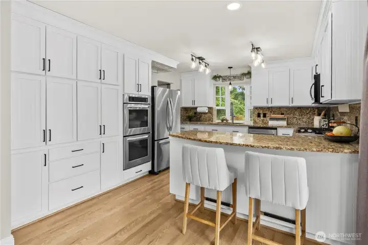 Refinished custom cabinets, double ovens & breakfast bar Refinished custom cabinets, double ovens & breakfast bar