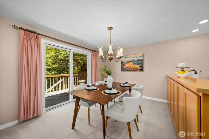 Gather for meals inside or take dinner outside to the large deck off the dining room. Gather for meals inside or take dinner outside to the large deck off the dining room.