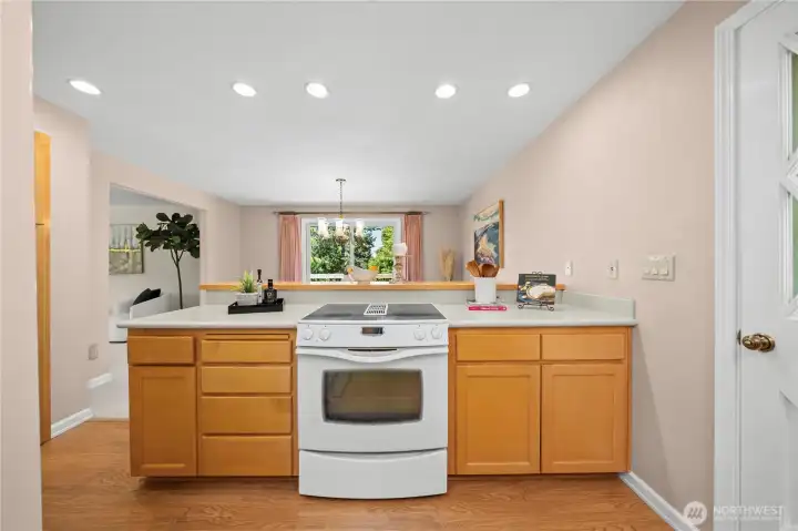 Updated kitchen with newer cabinets and countertops. Updated kitchen with newer cabinets and countertops.